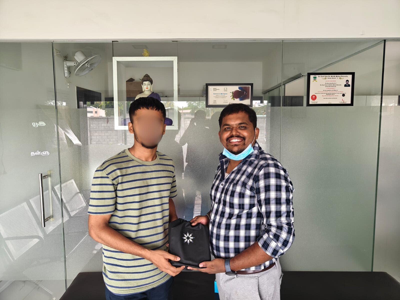 Dr. Karthi with patient — Invisalign delivery
