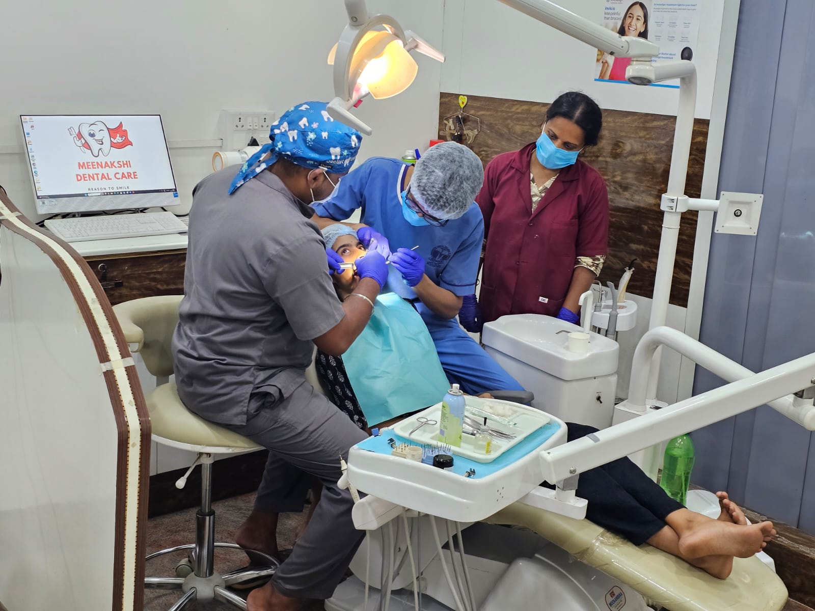 Dr. Karthi performing dental treatment